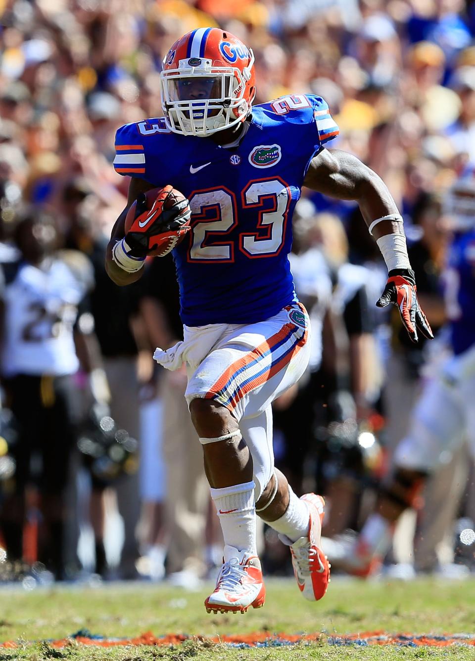 Mike Gillislee #23 of the Florida Gators runs for a touchdown during the game against the Missouri Tigers at Ben Hill Griffin Stadium on November 3, 2012 in Gainesville, Florida. (Photo by Sam Greenwood/Getty Images)