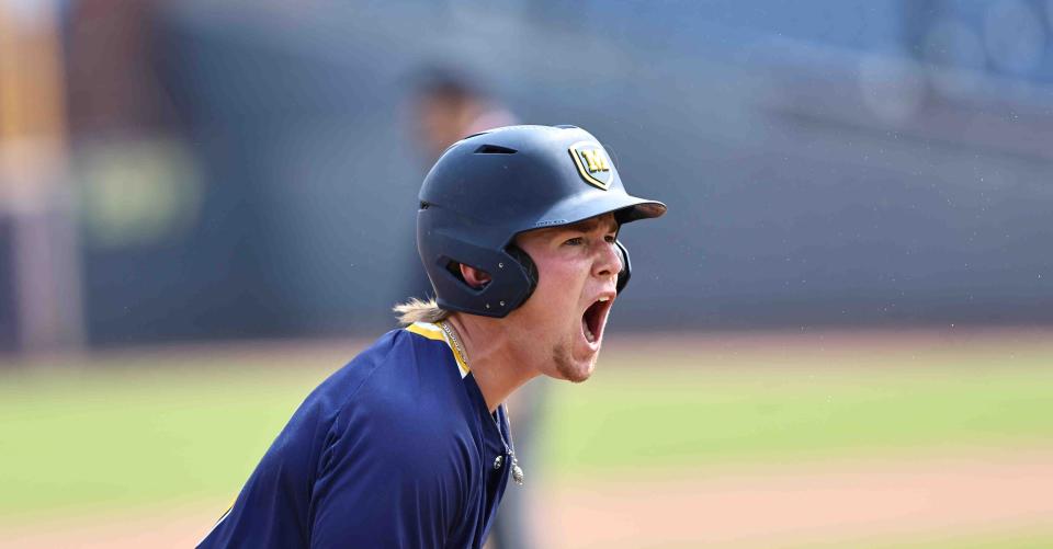 Moeller catcher Nathan Manley (5) reacts after a triple during the Crusaders' 2-0 win over Walsh Jesuit in the OHSAA state baseball Final Four game Thursday, June 8, 2023.