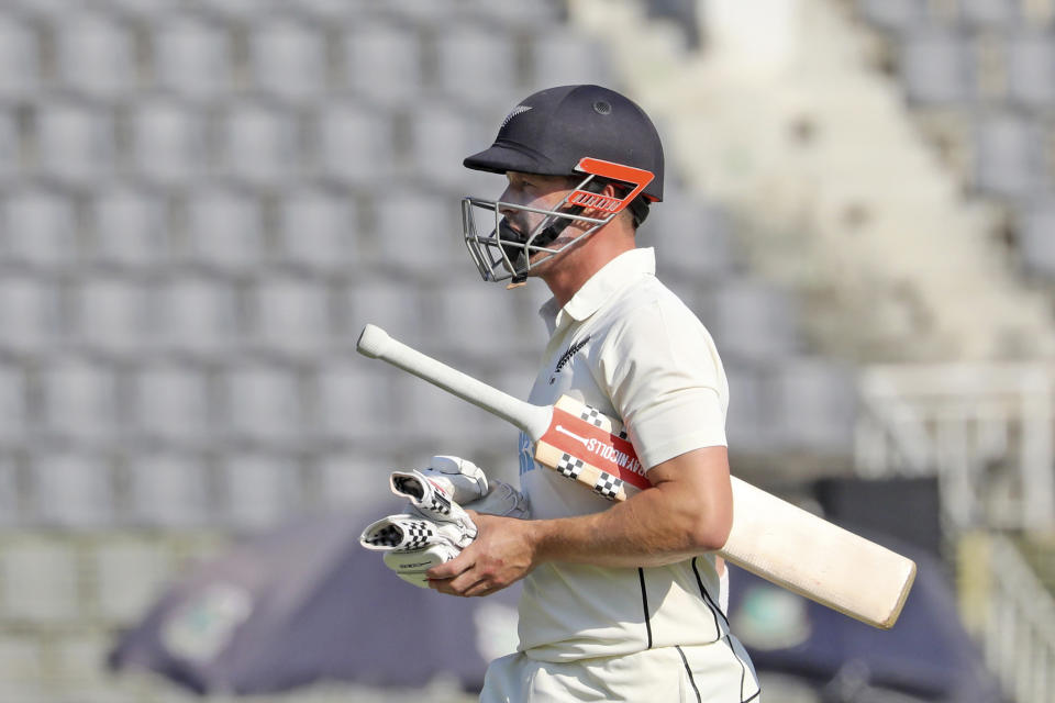 New Zealand's Henry Nicholls leaves the field after being dismissed during the fourth day of the first test cricket match at Sylhet, Bangladesh, Friday, Dec. 1, 2023. (AP Photo/Mosaraf Hossain)