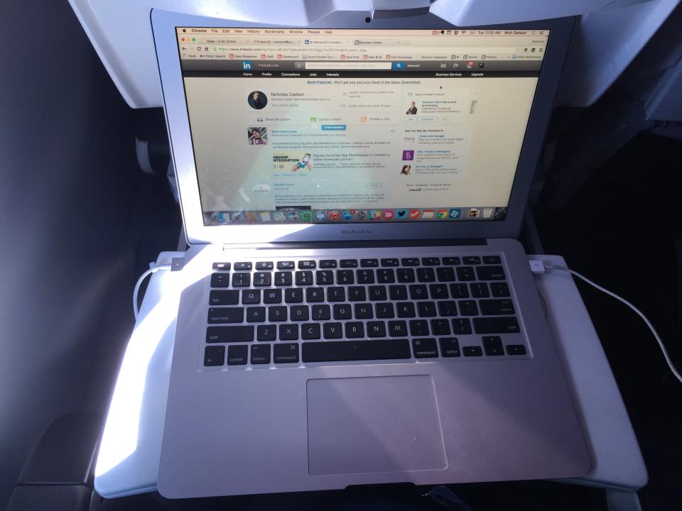 MacBook laptop on an airplane