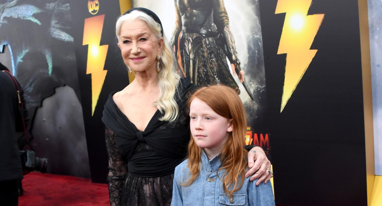 Helen Mirren and her step-grandson Basil walk the Shazam! Fury of the Gods red carpet. (Getty Images)