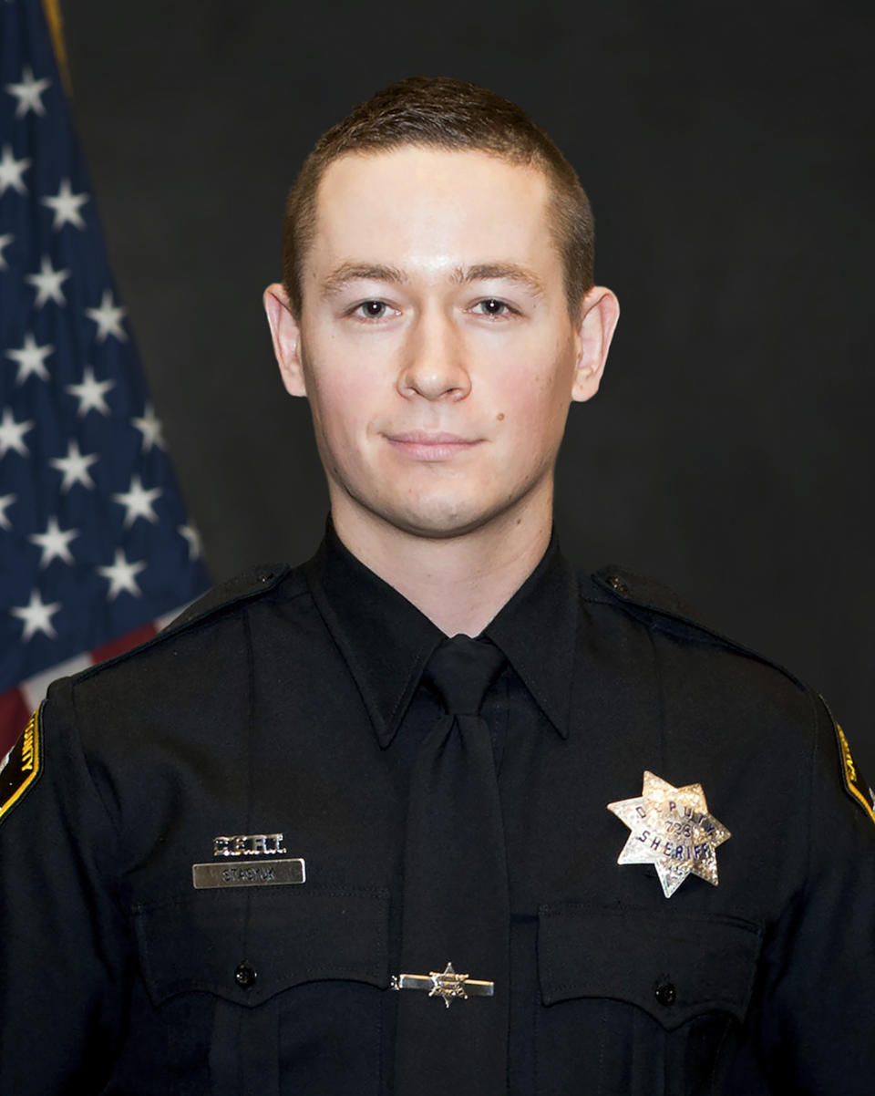 In this undated photo provided by the Sacramento County Sheriff's Office is Deputy Mark Stasyuk. The Sacramento County sheriff's deputy was killed and another wounded in a shootout Monday, Sept. 17, 2018, that started with an argument at a Pep Boys store, authorities said. The suspected gunman and a bystander were wounded, but they were expected to survive, Sheriff Scott Jones said. Stasyuk, 27, was shot in the upper body and killed. Deputy Julie Robertson, 28, was hit in the arm but shot back as the attacker fled. (Sacramento County Sheriff's Office via AP)