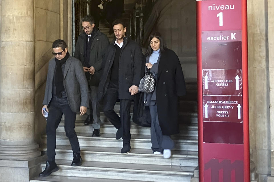 FILE - Moroccan singer Saad Lamjarred, second right, leaves the court house Monday, Feb. 20, 2023 in Paris. Saad Lamjarred, 37, has been on trial in Paris since Monday for aggravated rape and assault. A verdict is expected later Friday Feb.24, 2023. (AP Photo/Sylvie Corbet, FILE)