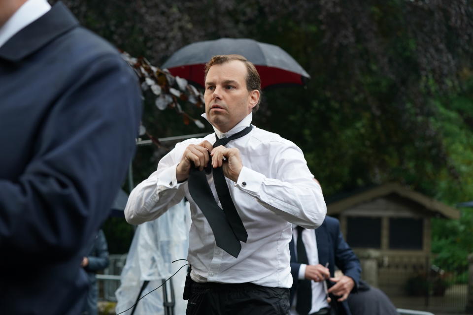 <p>BBC reporter James Cook putting on a black tie outside Balmoral in Scotland. The Queen died peacefully at Balmoral this afternoon, Buckingham Palace has announced. Picture date: Thursday September 8, 2022. (Photo by Andrew Milligan/PA Images via Getty Images)</p> 