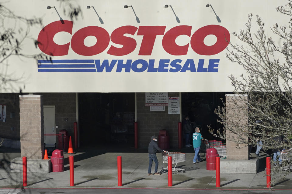 Shoppers walk into a Costco store, Wednesday, March 3, 2021, in Tacoma, Wash. Costco Wholesale Corp. reports earnings results, Thursday, March 4, 2021. (AP Photo/Ted S. Warren)