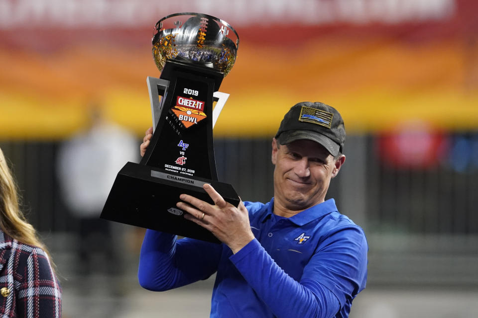 Air Force head coach Troy Calhoun celebrates after defeating Washington State 31-21 during the Cheez-It Bowl NCAA college football game, Friday, Dec. 27, 2019, in Phoenix. (AP Photo/Rick Scuteri)