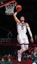 <p>Zachary Lavine #5 of Team United States goes up for a dunk against Team Australia during the second half of a Men's Basketball quarterfinals game on day thirteen of the Tokyo 2020 Olympic Games at Saitama Super Arena on August 05, 2021 in Saitama, Japan. (Photo by Kevin C. Cox/Getty Images)</p> 