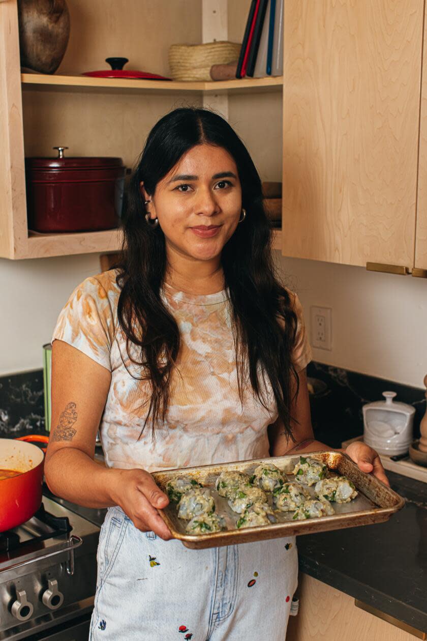 Paola Briseno Gonzalez preparing Caldo de Albóndigas de Camarón.