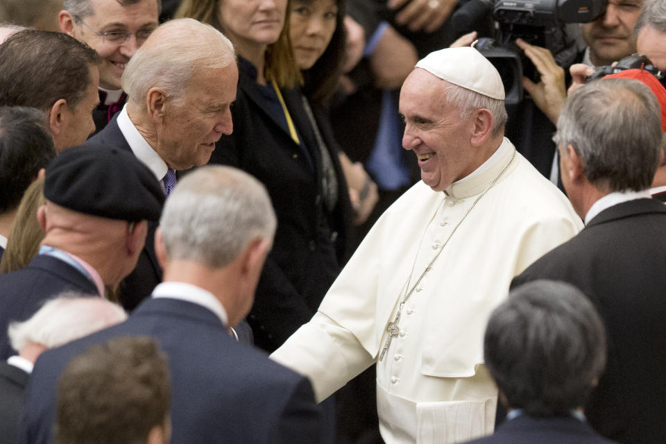 FILE - In this April 29, 2016, file photo, Vice President Joe Biden shakes hands with Pope Francis during a congress on the progress of regenerative medicine held at the Vatican. Biden has demonstrated a deep public connection to his Catholic faith, dating to the earliest days of his political career. (AP Photo/Andrew Medichini, File)