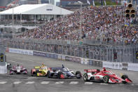 Marcus Ericsson (8) leads others through a turn during the Music City Grand Prix auto race Sunday, Aug. 7, 2022, in Nashville, Tenn. (AP Photo/Mark Humphrey)