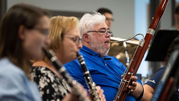 PHOTO: Nurse Ian Barnett plays the bassoon during a rehearsal of AdventHealth's all-employee orchestra, fall 2022. (Matt Rainey/AdventHealth)