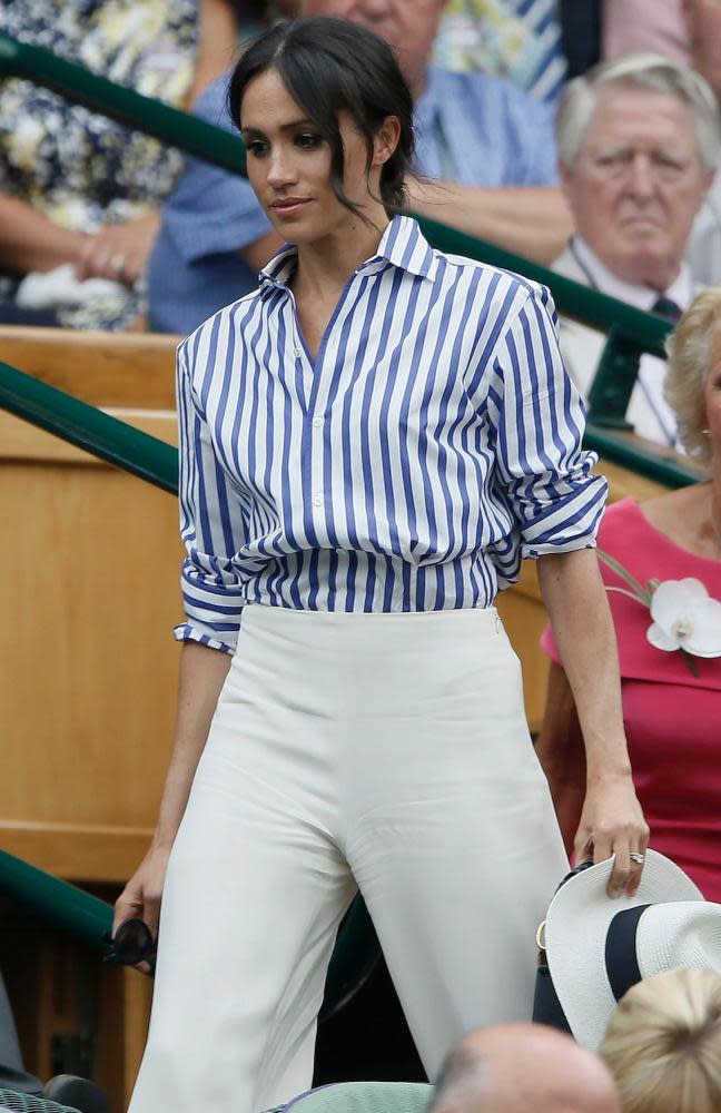 Meghan Markle, dressed by Ralph Lauren, arrives in the Royal box.