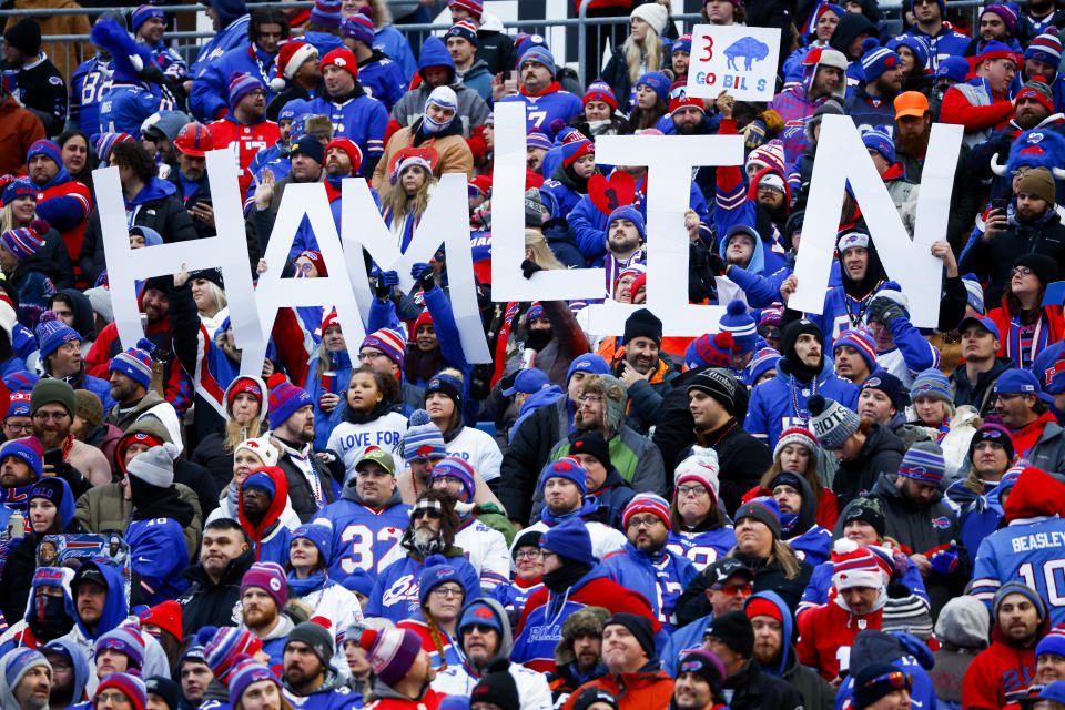 FILE - Fans hold a sign in support of Buffalo Bills safety Damar Hamlin during the second half of an NFL football game against the New England Patriots, Sunday, Jan. 8, 2023, in Orchard Park. Bills safety Damar Hamlin was released from a Buffalo hospital on Wednesday, Jan. 11, 2023, after his doctors said they completed a series of tests a little over a week after he went into cardiac arrest and had to be resuscitated during a game at Cincinnati. (AP Photo/Jeffrey T. Barnes, File)