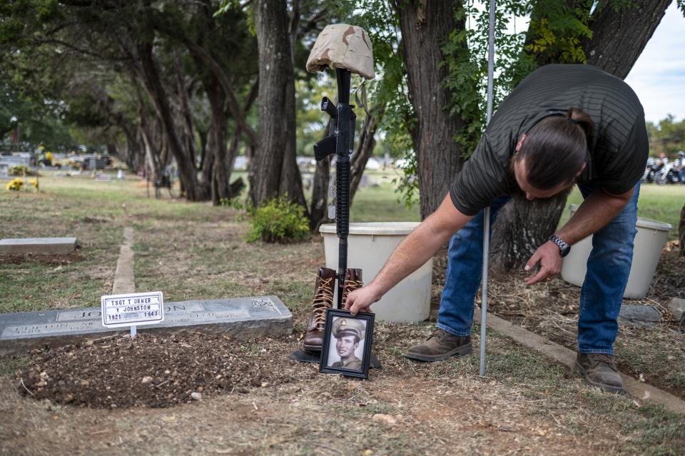 Dustin Shiplett, the manager of North Belton Cemetery, buries the remains of Sgt. Turner Yearwood Johnston last month. Johnston's unidentified body was buried for years in a Ploesti, Romania cemetery, then moved to an American cemetery in Belgium, before being exhumed in 2017 and identified this year using DNA.