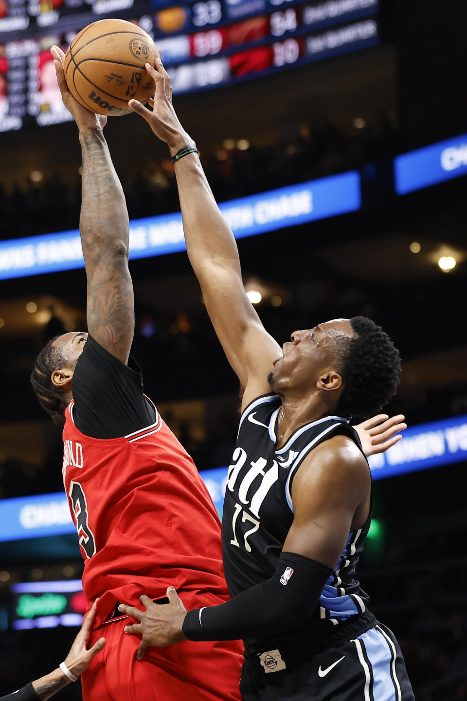 Atlanta Hawks forward Onyeka Okongwu, right, blocks a shot from Chicago Bulls center Andre Drummond during the first half of an NBA basketball game on Monday, Feb. 12, 2024, in Atlanta. (AP Photo/Alex Slitz)