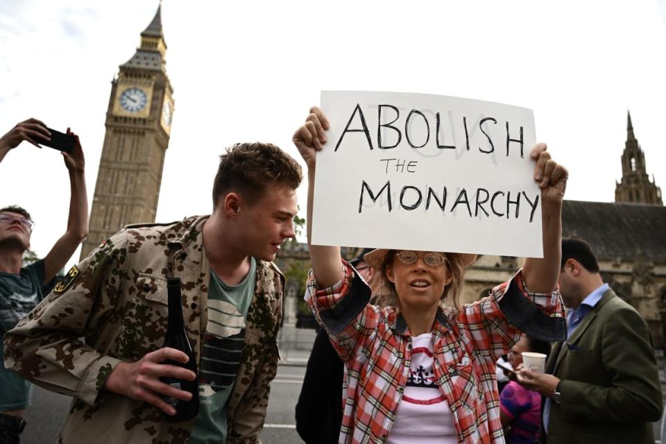 <div class="inline-image__caption"><p>An anti-Royal demonstrator protests outside Palace of Westminster, central London on September 12, 2022, following the death of Queen Elizabeth II on September 8. </p></div> <div class="inline-image__credit">MARCO BERTORELLO / Getty </div>