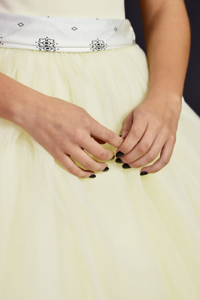 <em>Stranger Things</em> star Millie Bobby Brown’s ballerina dress was accessorized with a white bandana. (Photo: Getty Images)