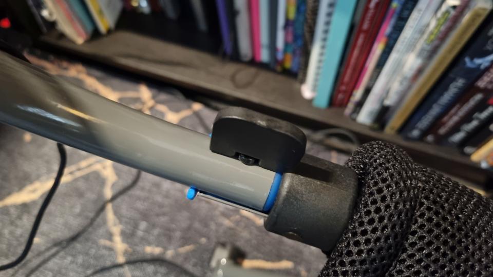 The wheelbase lock on the Logitech Playseat Challenge X in the closed position