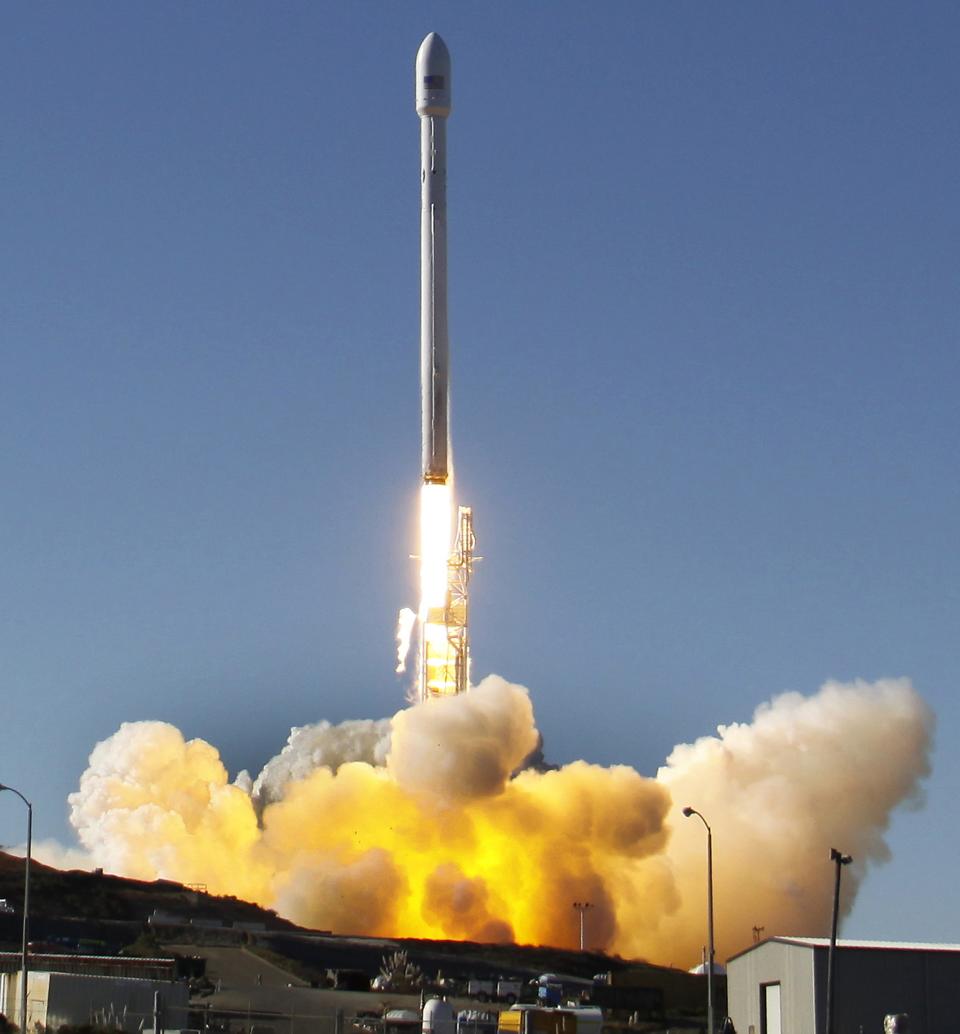 A Falcon 9 rocket carrying a small science satellite for Canada is seen as it is launched from a newly refurbished launch pad in Vandenberg Air Force Station