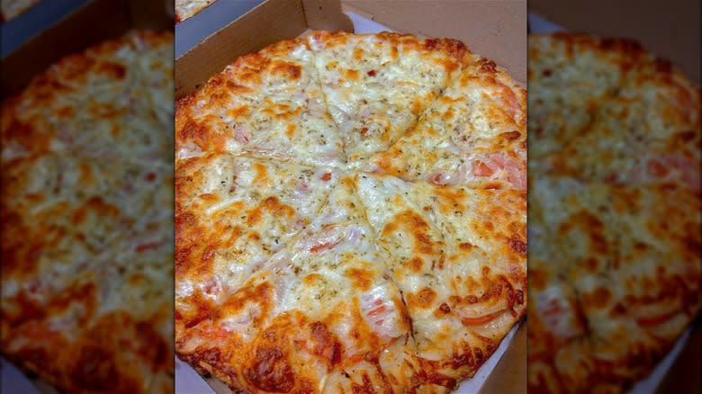 Artones cheese pizza in box
