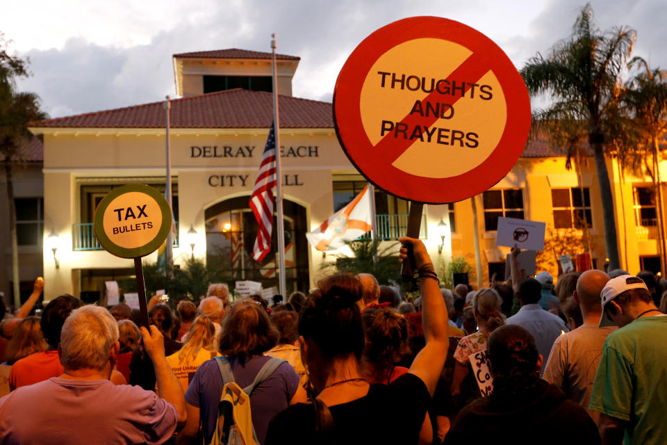 <p>Protesters take part in a Call To Action Against Gun Violence rally by the Interfaith Justice League and others in Delray Beach, Fla., Feb. 19, 2018. (Photo: Joe Skipper/Reuters) </p>