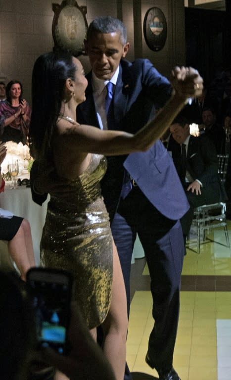 US President Barack Obama dances tango with Argentinian dancer Mora Godoy during a state dinner in Buenos Aires