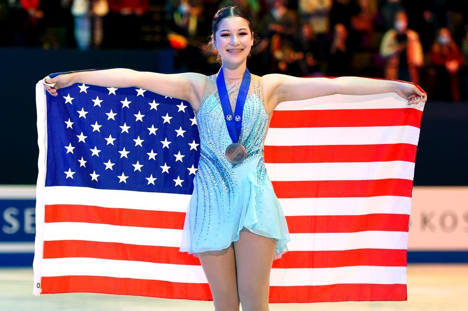 Bronze medallist US Alysa Liu celebrates during the medal ceremony after the women's free skating event at the ISU World Figure Skating Championships in Montpellier, southern France, on March 25, 2022. (Photo by Sylvain THOMAS / AFP) (Photo by SYLVAIN THOMAS/AFP via Getty Images)