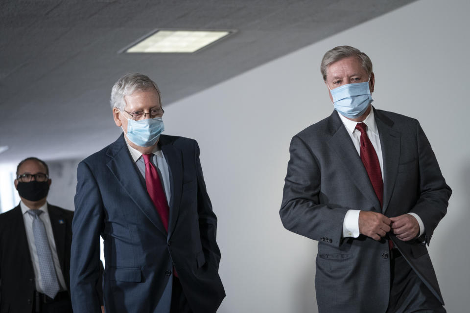 Senate Majority Leader Mitch McConnell (R-Ky.) and Sen. Lindsey Graham (R-S.C.) arrive for a meeting with GOP senators on Capitol Hill, May 19, 2020.  (Photo: Drew Angerer via Getty Images)