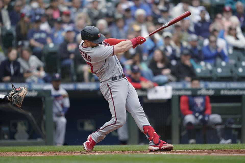 Minnesota Twins' Ryan Jeffers hits a double against the Seattle Mariners during the fifth inning of a baseball game Wednesday, June 15, 2022, in Seattle. (AP Photo/Ted S. Warren)