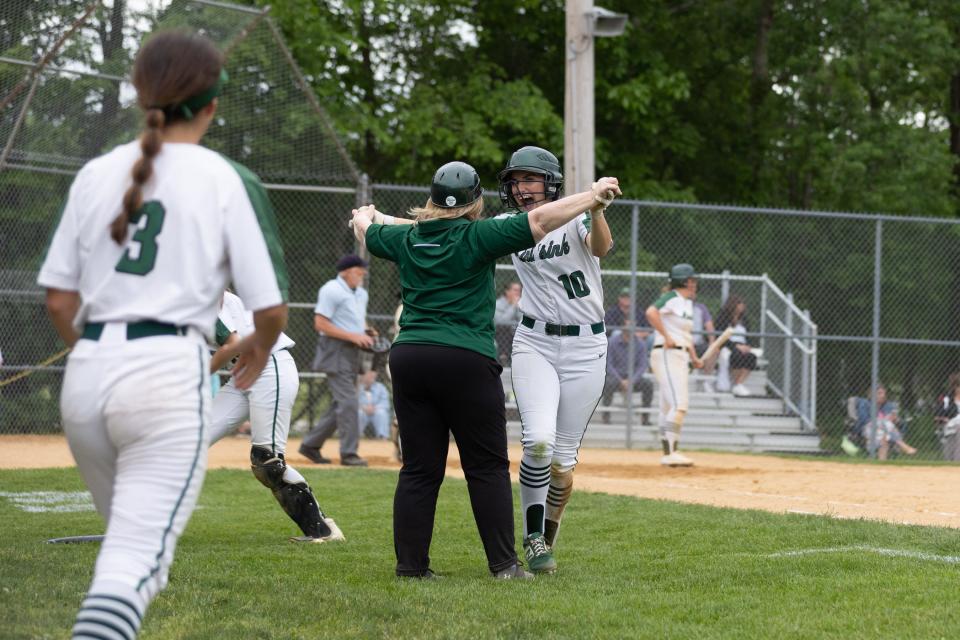 Minisink Valley assistant coach Joan Golden congratulates Hannah Moulton for scoring the tying run against Roosevelt. ALLYSE PULLIAM/For the Times Herald-Record