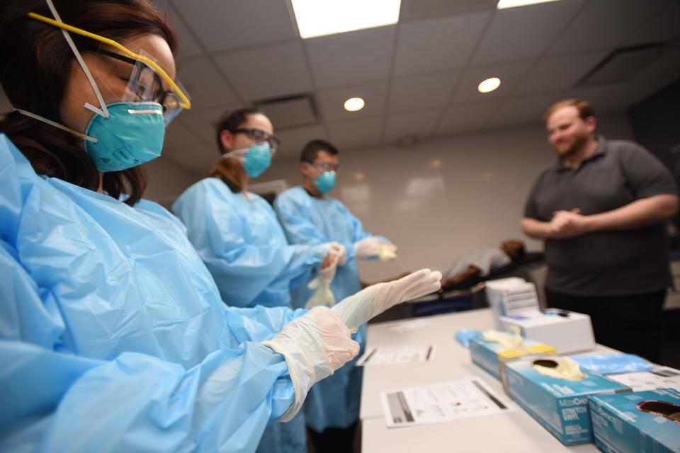 Nurse Jennifer Tempo takes part in COVID-19 training with personal protective equipment (PPE) at Holy Name Medical Center in Teaneck, N.J., on Feb. 24.