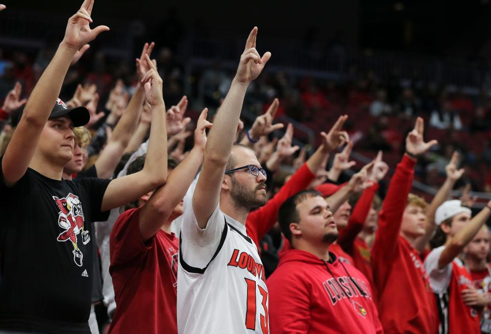 U of L fans flashed “L’s” during their game against Southern University at the Yum Center in Louisville, Ky. on Nov. 9, 2021. U of L won 72-60.