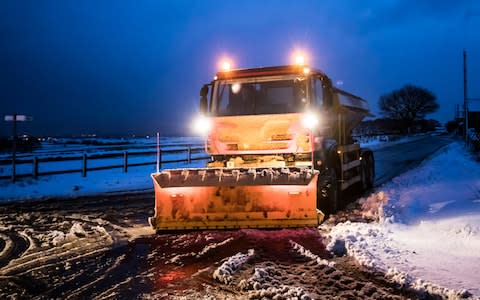 A gritter in snowy conditions near Snowden Hill in Sheffield, South Yorkshire - Credit: Danny Lawson /PA