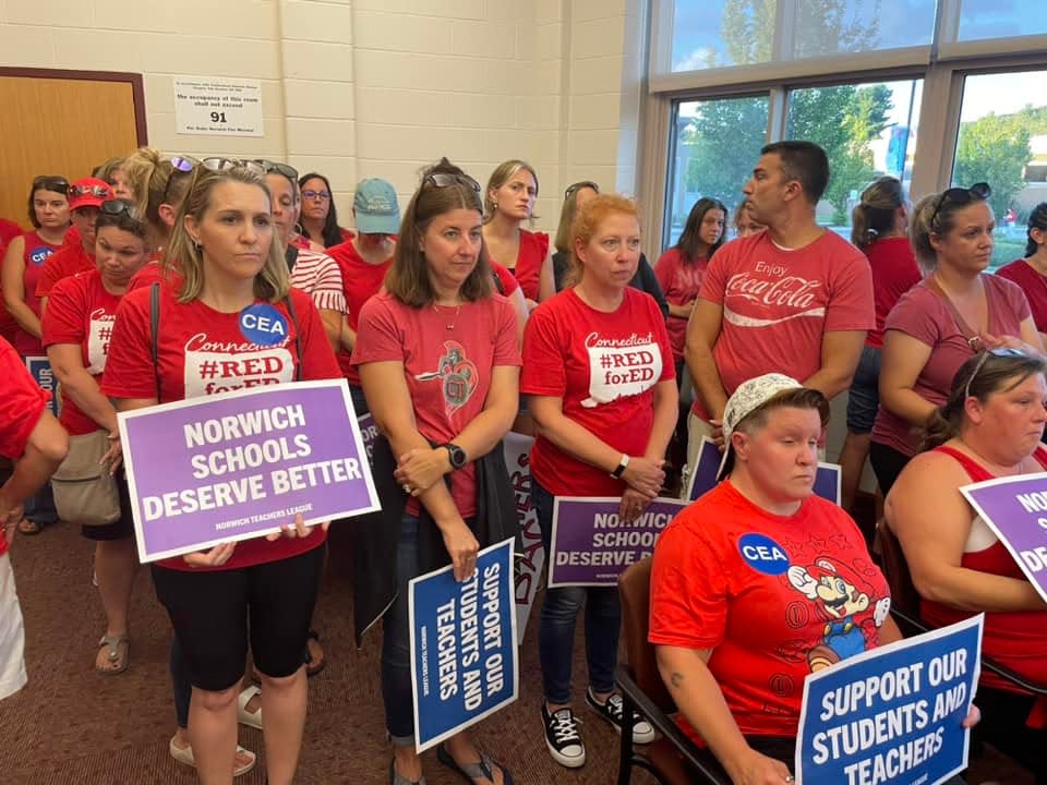 The Norwich Board of Education special meeting was packed Tuesday, as there were more rally-goers in red than the room could fit.