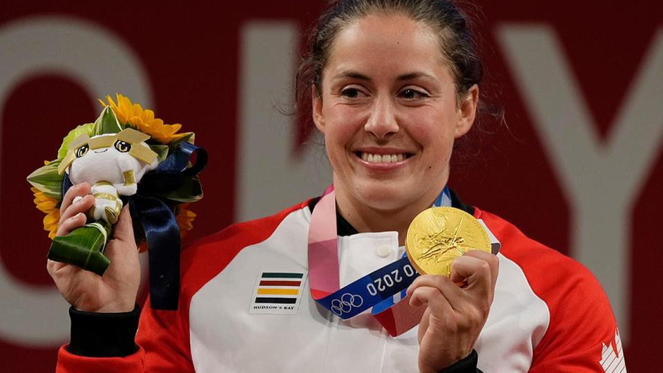 Claire Garon, the mother of Canadian weightlifter Maude Charron (pictured), watched through a television screen as her daughter cried as she won a gold medal at the 2021 Tokyo Olympics. "I had the feeling that I was not in the right place," she remembers. 