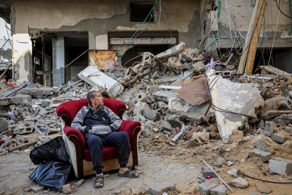 November 29, 2023: A Palestinian man sits in an armchair outside a destroyed building in Gaza City on the sixth day of the temporary cease-fire between Hamas and Israel. International mediators on Wednesday worked to extend the truce in Gaza, encouraging Hamas militants to keep freeing hostages in exchange for the release of Palestinian prisoners and further relief from Israel's air and ground offensive.
