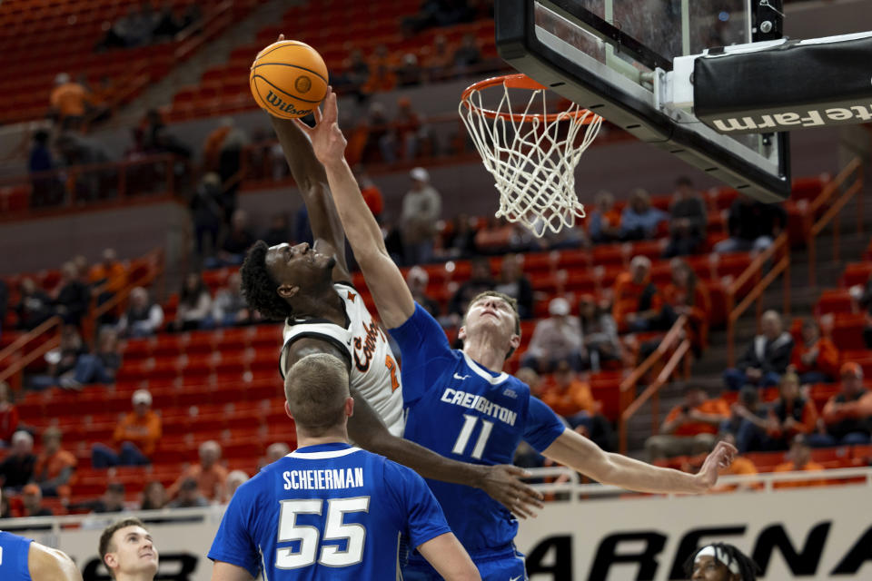 Creighton center Ryan Kalkbrenner (11) blocks Oklahoma State forward Eric Dailey Jr. in the second half of an NCAA college basketball game, Thursday, Nov. 30, 2023, in Stillwater, Okla. (AP Photo/Mitch Alcala)