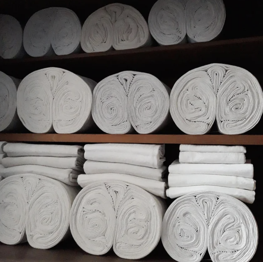 folded sheets in a cupboard