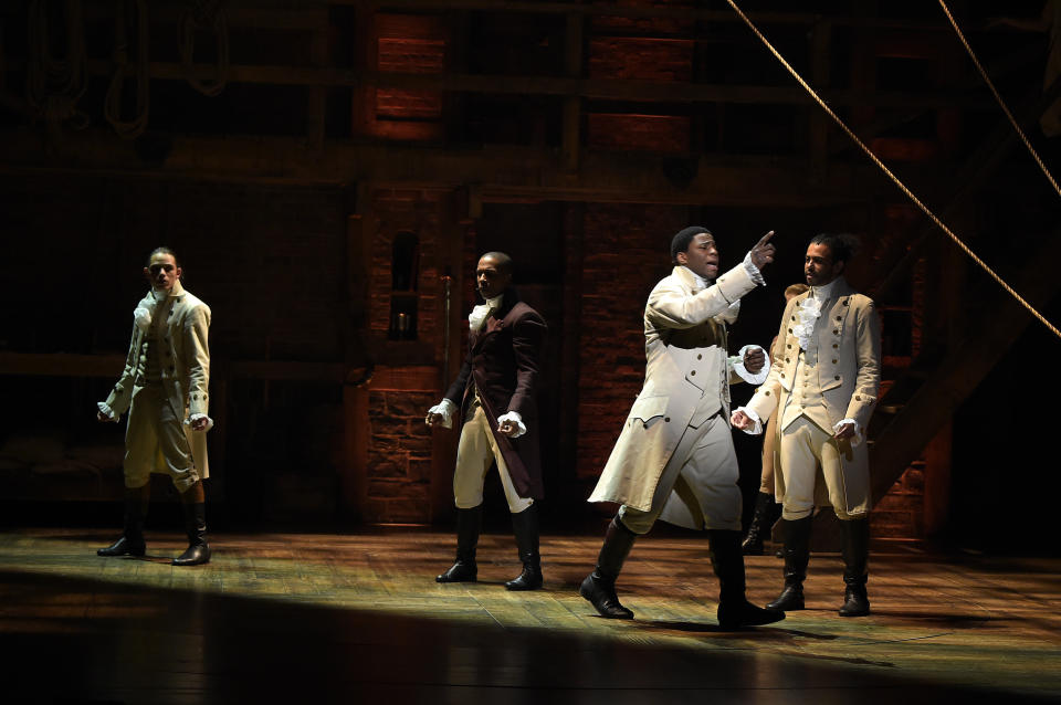 NEW YORK, NY - FEBRUARY 15:  Actors Okieriete Onaodowan (Front)  performs on stage during 'Hamilton' GRAMMY performance for The 58th GRAMMY Awards at Richard Rodgers Theater on February 15, 2016 in New York City.  (Photo by Theo Wargo/WireImage)