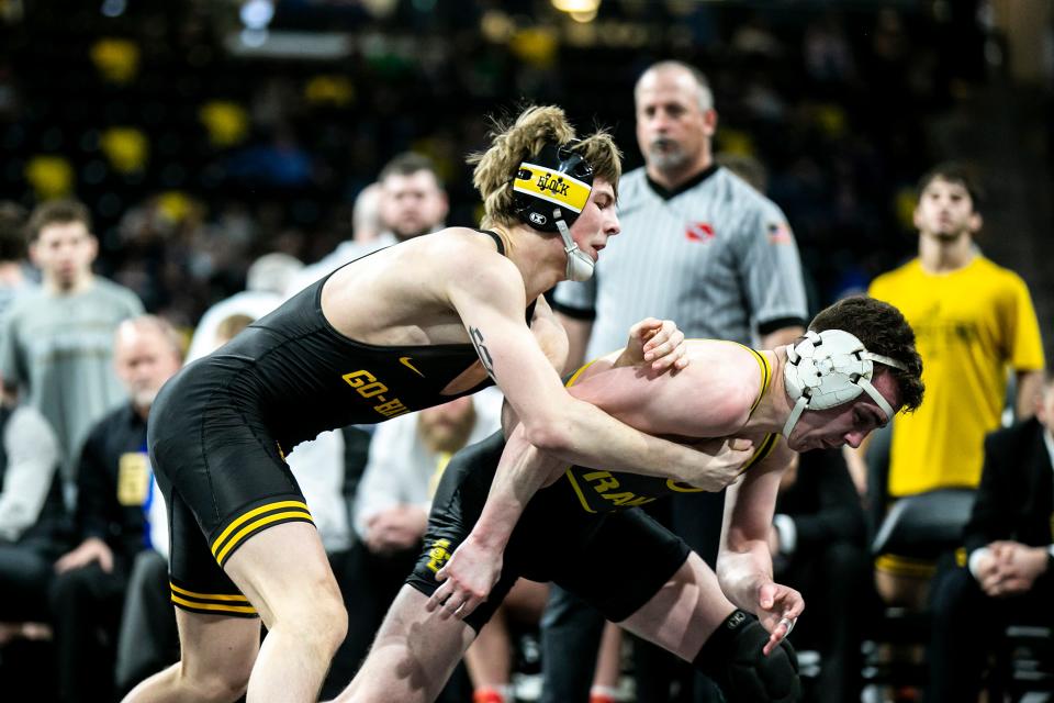 Waverly-Shell Rock's Ryder Block, left, wrestles Southeast Polk's Trevor Oberbroeckling at 138 pounds during the Class 3A boys state wrestling duals, Saturday, Feb. 4, 2023, at Xtream Arena in Coralville, Iowa.