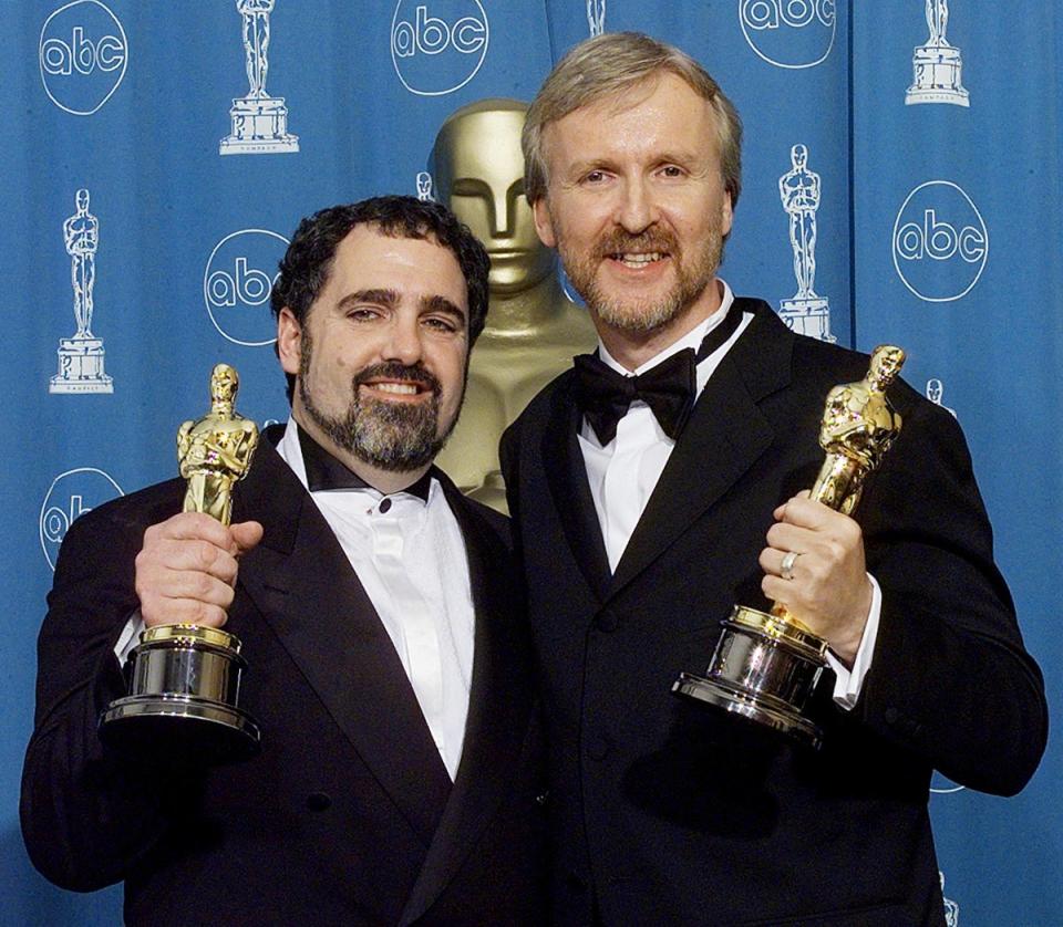John Landau (L) won Best Picture and James Cameron Best Picture, Director, and Editor (Hector Mata / AFP via Getty Images)