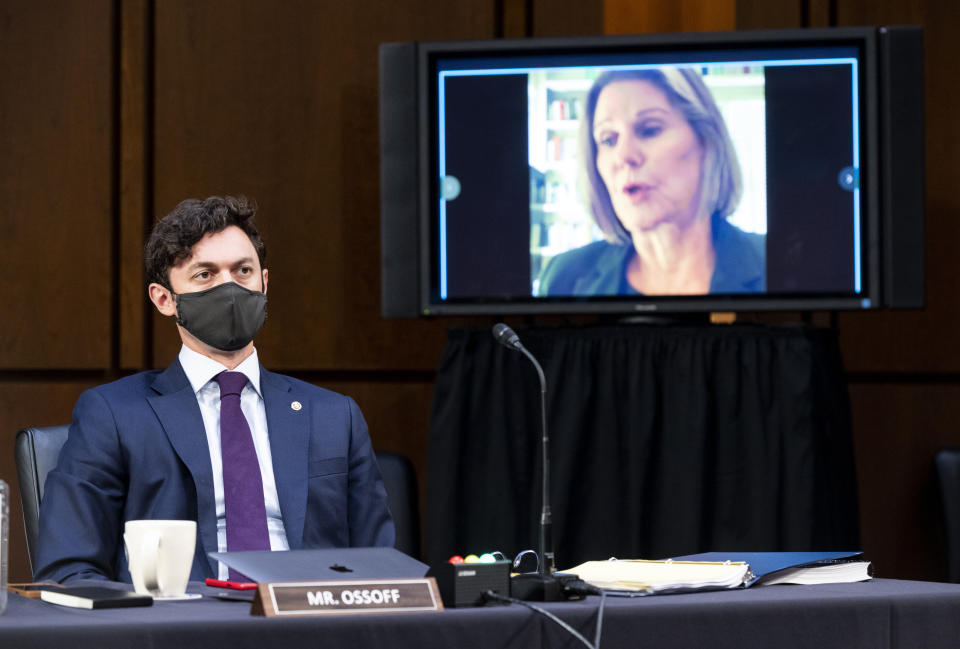 Sen. Jon Ossoff (D-Ga.) listens as Jan Jones, speaker pro tempore in the Georgia House of Representatives, speaks during a Senate Judiciary Committee hearing on Capitol Hill on Tuesday. The committee is hearing testimony on voting rights in the U.S.  (Photo: Photo by Bill Clark-Pool/Getty Images)