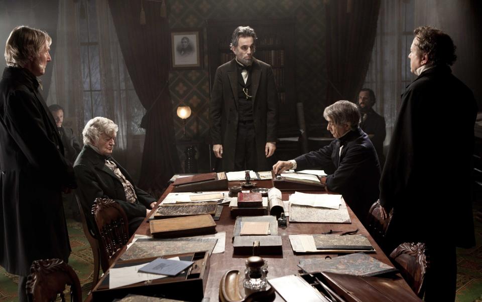 This undated publicity photo released by Walt Disney Pictures shows, Daniel Day-Lewis, center rear, as Abraham Lincoln, in a scene from the film, "Lincoln." “Lincoln” opens in limited release Nov. 9, 2012, and nationwide Nov. 16, just after the U.S. presidential election. (AP Photo/Disney-DreamWorks II, David James)