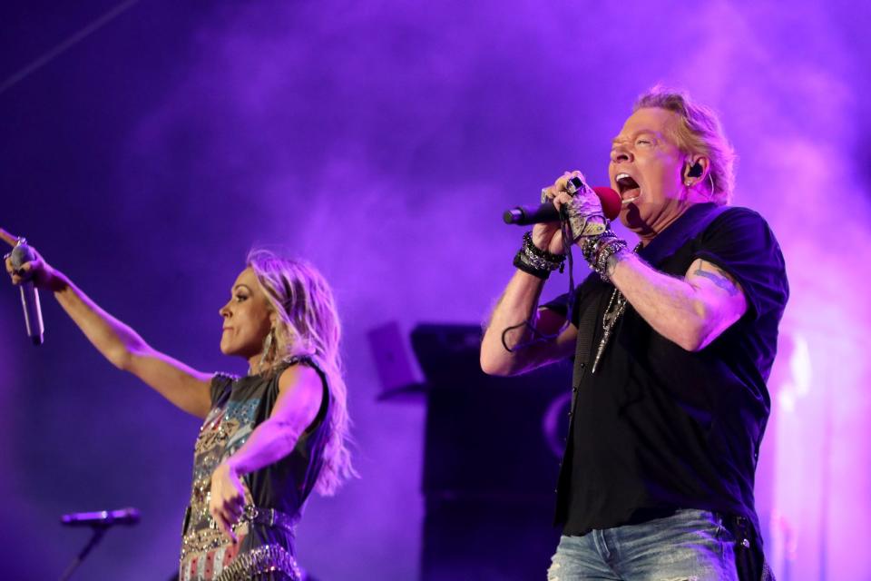 Special guest Axl Rose of Guns N' Roses, right, performs with headliner Carrie Underwood at Stagecoach country music festival in Indio, California, on April 30, 2022.