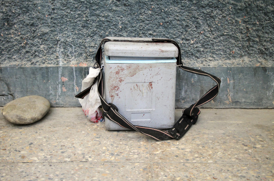 A bloodied Polio Vaccine Box is left on the ground after women working to administer the anti-polio vaccine are killed by gunmen in the city of Jalalabad east of Kabul, Afghanistan, Tuesday, March 30, 2021. Afghan officials said attackers gunned down three women in two separate attacks on Tuesday in Jalalabad. (AP Photo)