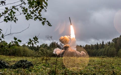 An Iskander missile, which can carry nuclear or conventional warheads, is launched during exercises outside St Petersburg - Credit: Russian Defense Ministry Press Service via AP/File