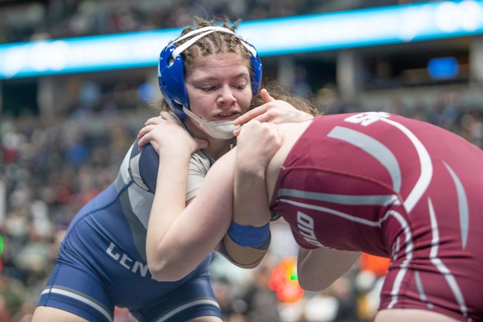 Pueblo Central's Kenna Pino clinches with Berthoud's Abi Speer during their girls 140-pound first-round matchup of CHSAA state wrestling tournament on Thursday, February, 15, 2024.