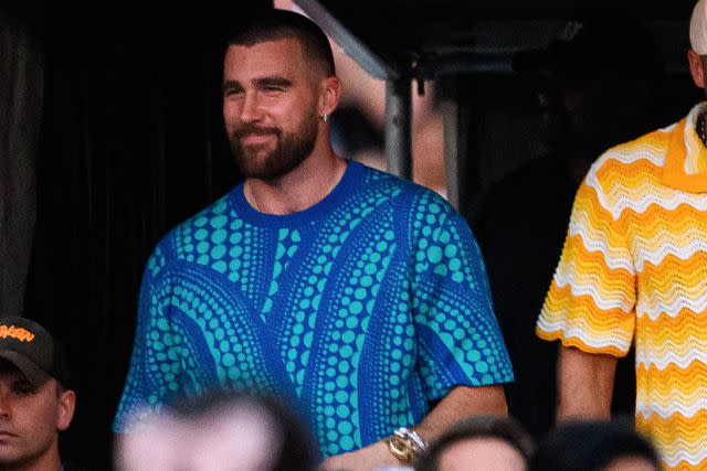 <p>James Gourley/Shutterstock</p> Travis Kelce rocks a bold outfit as he cheers on Taylor Swift