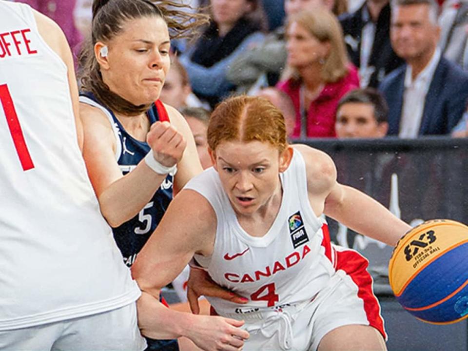 Kacie Bosch, right, dribbles away from French defender during Saturday's quarterfinal game at at the women’s 3x3 basketball World Cup in Vienna, Austria. France, the defending champions, won 14-13 to end Canada's tourney after it captured silver a year ago. (Twitter/@CanBball - image credit)