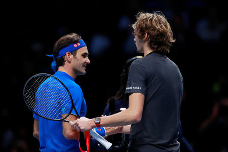 Tennis - ATP Finals - The O2, London, Britain - November 17, 2018 Germany's Alexander Zverev shakes hands with Switzerland's Roger Federer after winning his semi final match Action Images via Reuters/Andrew Couldridge